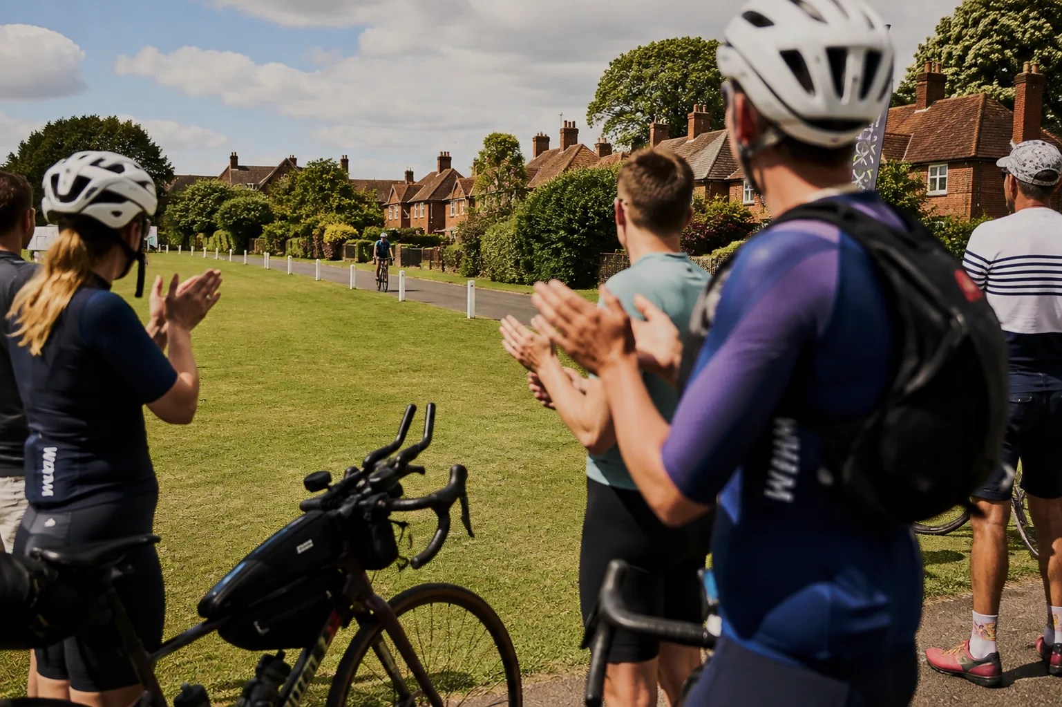 Solstice Series riders applauding a fellow rider as they return.